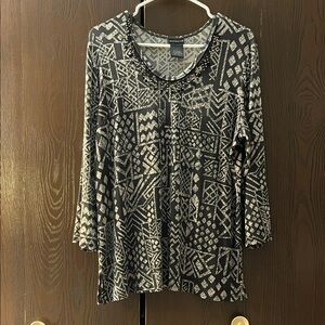 Citiknits dark green top with tan design. Size Large.